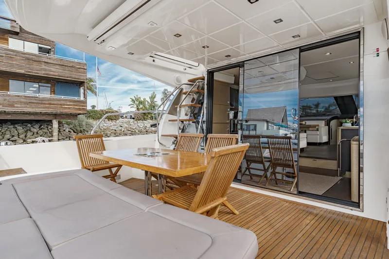 Slide: The Image of Luxurious outdoor area of a 2018 Prestige 560 yacht. - 13