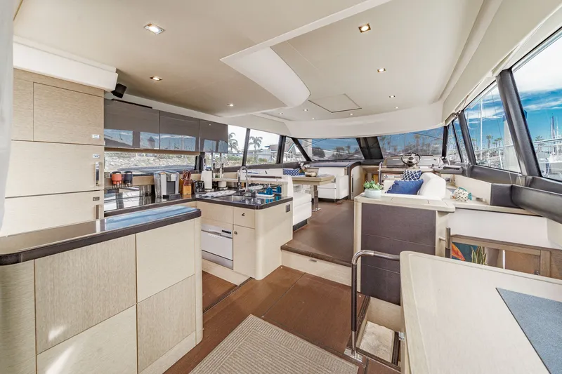 Slide: The Image of Interior of a 2018 Prestige 560 yacht with modern kitchen and lounge. - 14