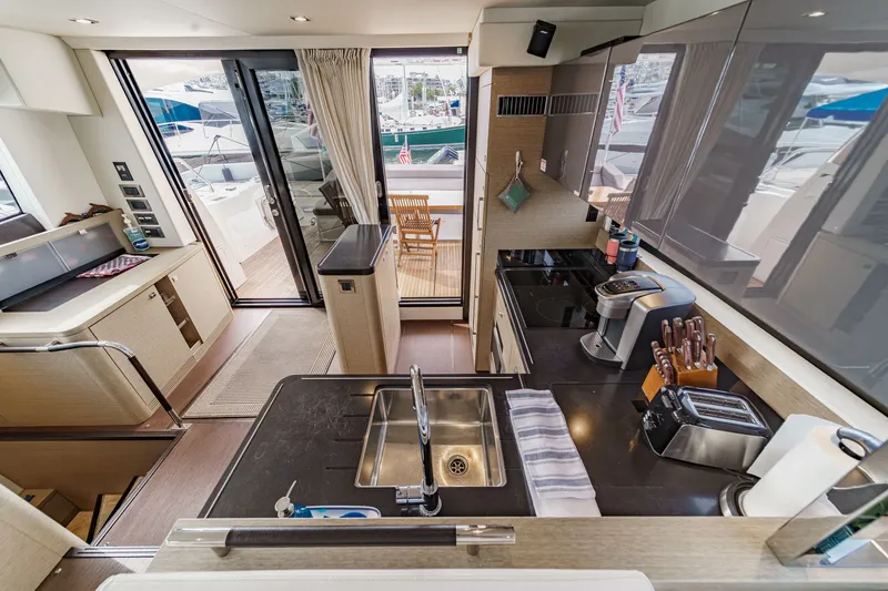 Slide: The Image of Interior of a 2018 Prestige 560 yacht, modern kitchen with appliances. - 17