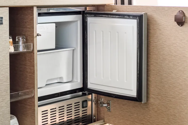 Slide: The Image of Open refrigerator in a 2018 Prestige 560 yacht. - 20