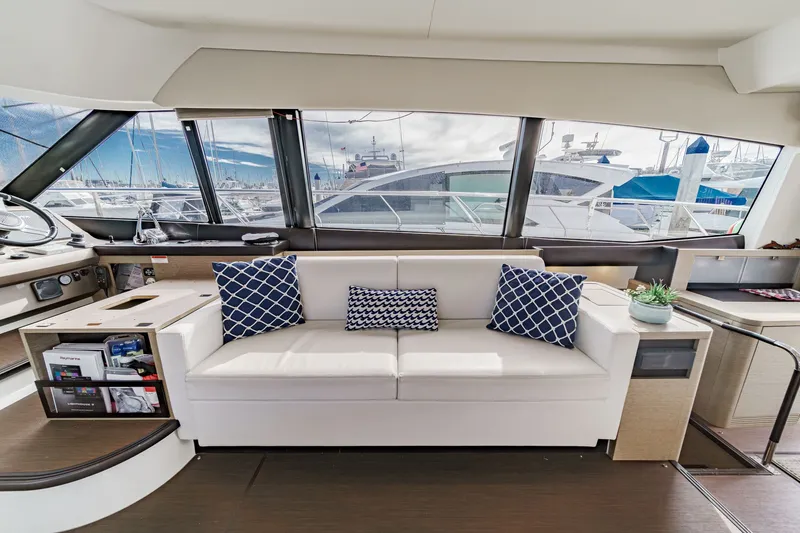 Slide: The Image of Interior of a 2018 Prestige 560 yacht with sofa and cushions. - 24