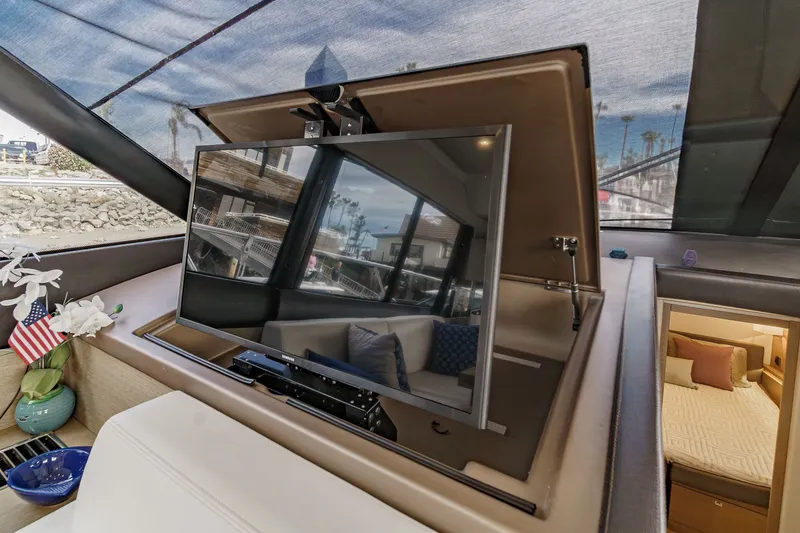 Slide: The Image of Luxurious interior of a Prestige 560 yacht with retractable TV. - 25