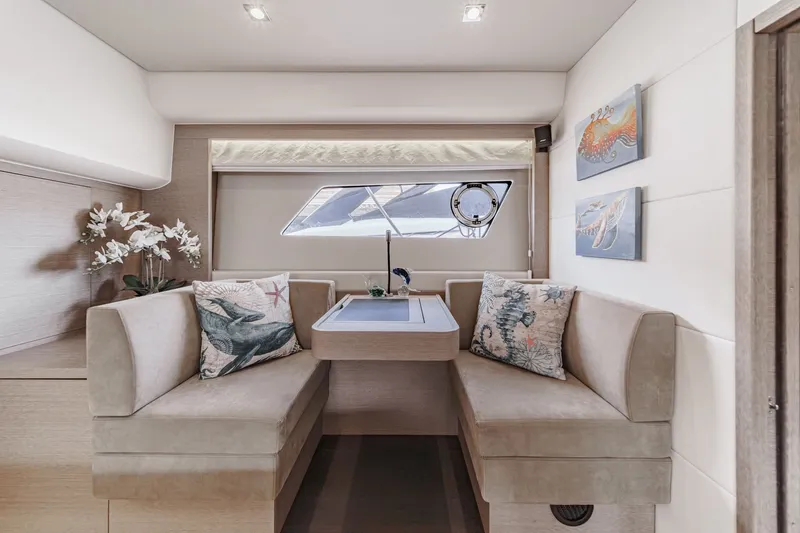 Slide: The Image of Interior of a 2018 Prestige 560 yacht with elegant seating area. - 29