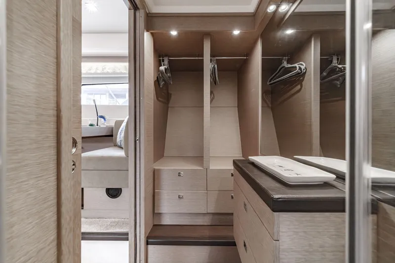 Slide: The Image of Luxurious closet in Prestige 560 yacht, model year 2018. - 34