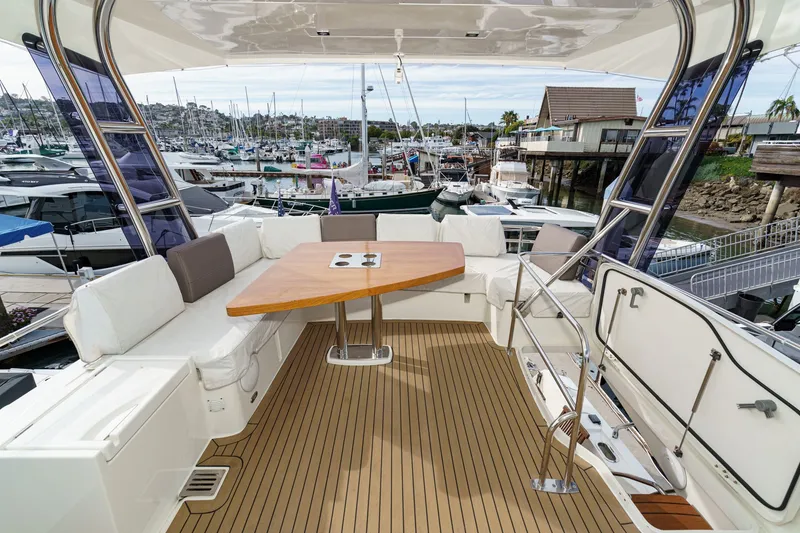 Slide: The Image of Luxurious deck of a 2018 Prestige 560 yacht in the marina. - 6