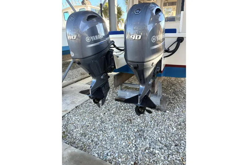 Slide: The Image of Twin Yamaha 90 outboard motors on a 1999 Rosborough 246 boat. - 10