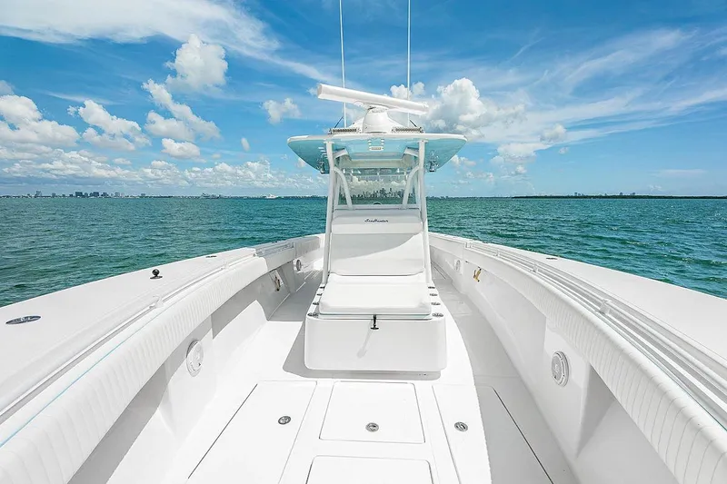Slide: The Image of 2017 SeaHunter 39 boat on open water under a clear blue sky. - 11