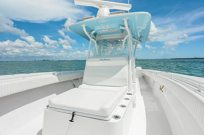 Slide: The Image of 2017 SeaHunter 39 boat on open water under a clear blue sky. - 12