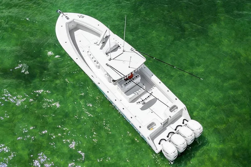 Slide: The Image of Aerial view of 2017 SeaHunter 39 boat on clear green water. - 13