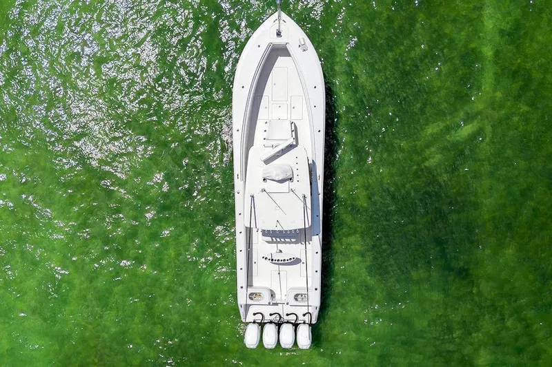 Slide: The Image of Aerial view of 2017 SeaHunter 39 boat on vibrant green water. - 14