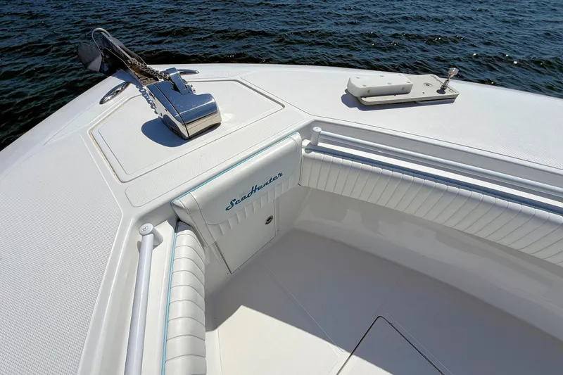 Slide: The Image of Bow of 2017 SeaHunter 39 boat with anchor, white seating, and ocean view. - 15