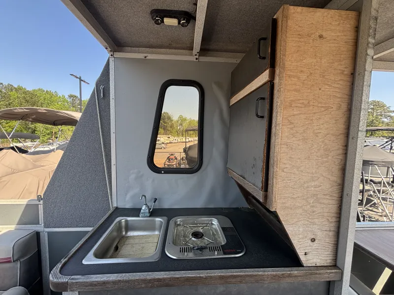 Slide: The Image of Interior of 1990 Sun Tracker Party Hut 28 with sink and stove. - 10