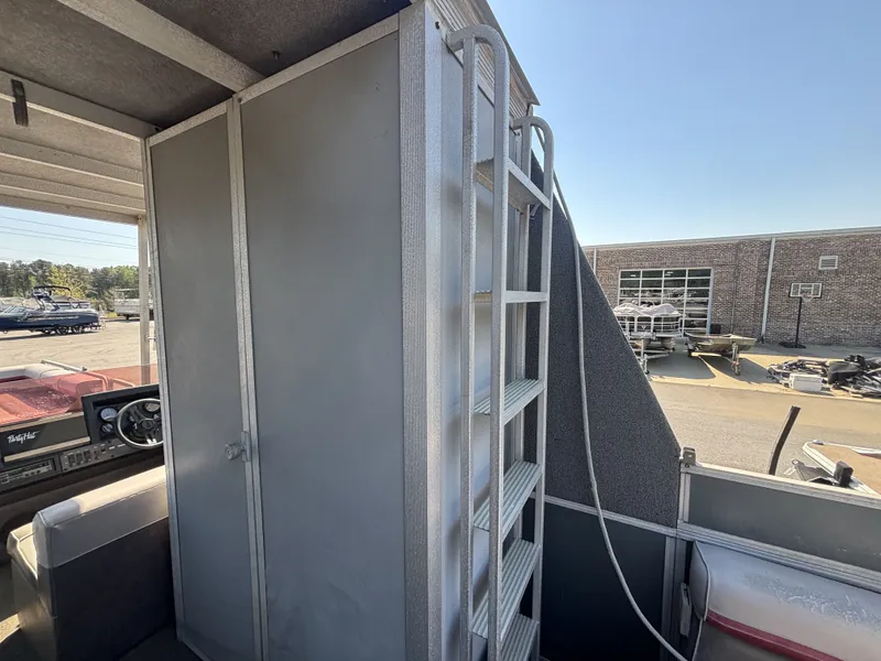 Slide: The Image of Interior of a 1990 Sun Tracker Party Hut 28 with steering console. - 11