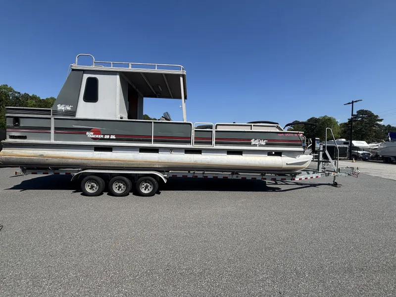 Slide: The Image of 1990 Sun Tracker Party Hut 28 on trailer, side view. - 12