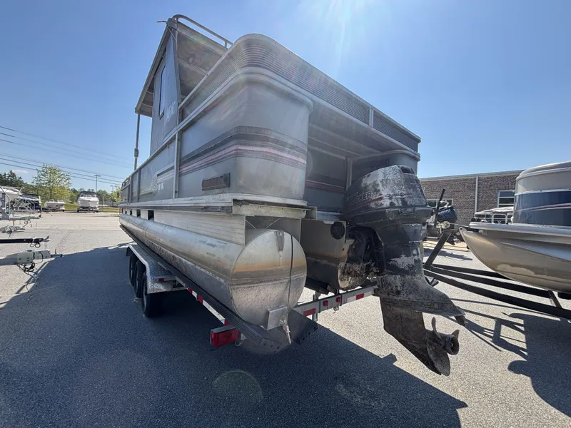 Slide: The Image of 1990 Sun Tracker Party Hut 28 on trailer, side view. - 13