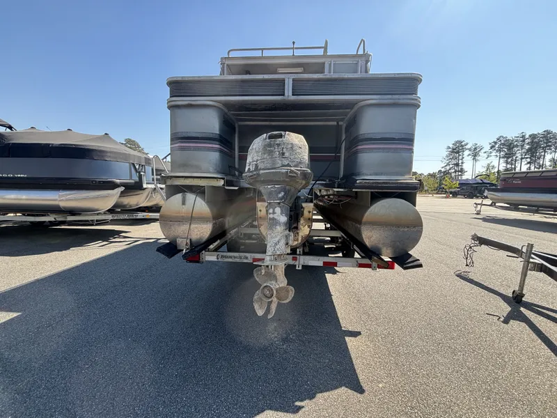 Slide: The Image of 1990 Sun Tracker Party Hut 28 pontoon boat on trailer. - 4