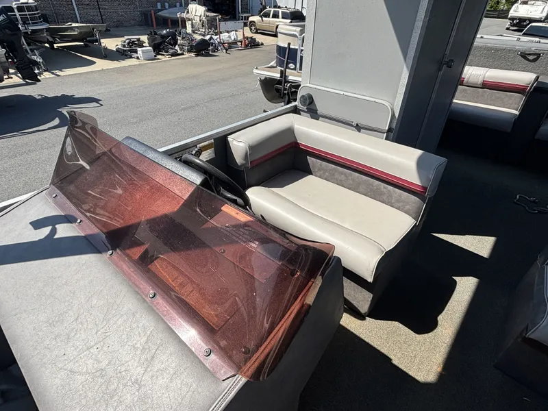 Slide: The Image of Interior of a 1990 Sun Tracker Party Hut 28 with seating area. - 8