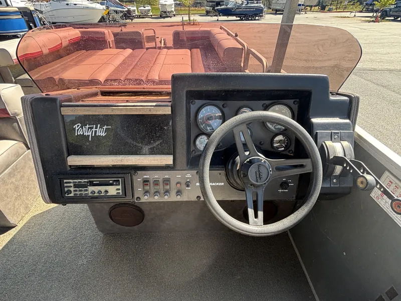 Slide: The Image of Dashboard of a 1990 Sun Tracker Party Hut 28 pontoon boat. - 9
