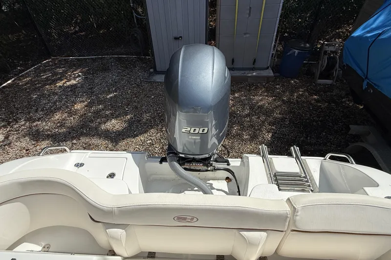 Slide: The Image of 2020 Sea Hunt Ultra 225 boat with Yamaha 200 engine, rear view. - 12