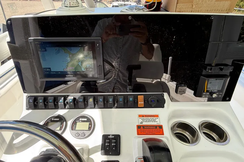 Slide: The Image of 2020 Sea Hunt Ultra 225 dashboard with Garmin GPS and control panel. - 15