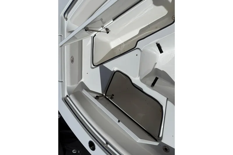 Slide: The Image of Open storage compartments on a 2020 Sea Hunt Ultra 225 boat. - 18