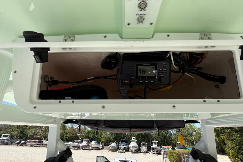 Slide: The Image of 2020 Sea Hunt Ultra 225 boat console with Garmin marine radio and wiring. - 20