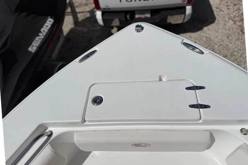 Slide: The Image of Bow view of a 2020 Sea Hunt Ultra 225 boat, featuring a storage compartment. - 29