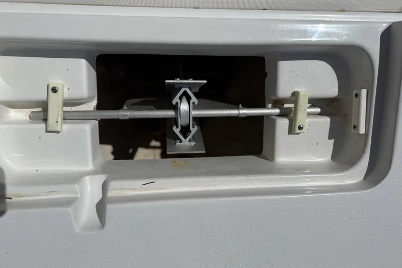 Slide: The Image of Compartment latch mechanism on a 2020 Sea Hunt Ultra 225 boat. - 32