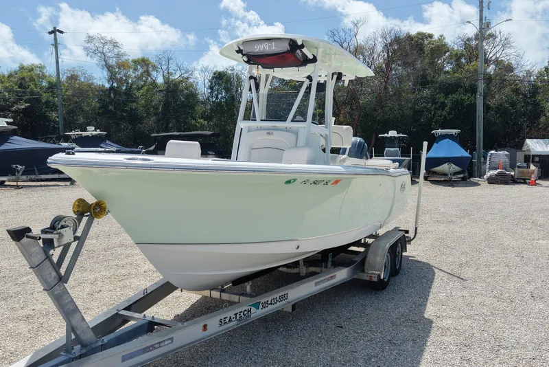 Slide: The Image of 2020 Sea Hunt Ultra 225 boat on trailer in outdoor storage area. - 6
