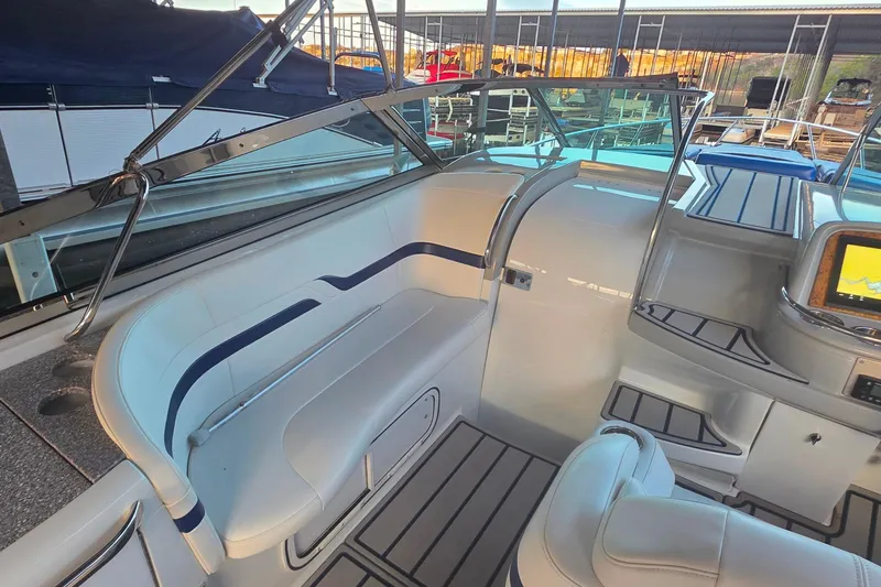 Slide: The Image of 2007 Formula 370 Super Sport boat interior with white seating and modern dashboard. - 16
