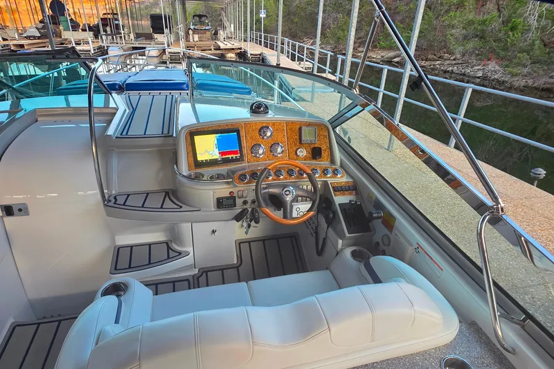 Slide: The Image of 2007 Formula 370 Super Sport boat cockpit with modern navigation controls and luxurious seating. - 17