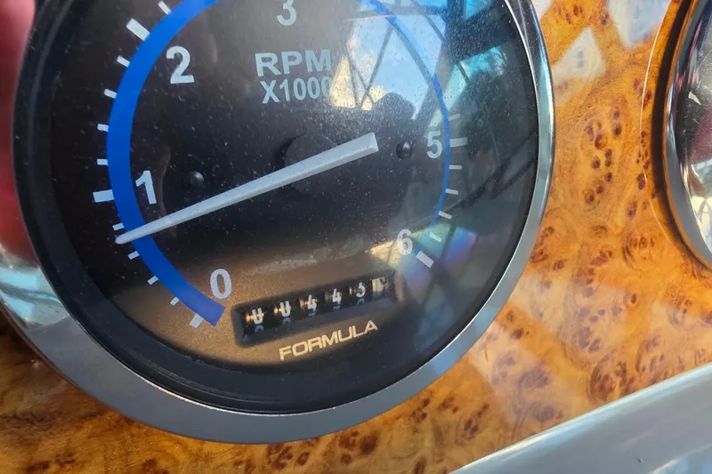 Slide: The Image of Close-up of 2007 Formula 370 Super Sport RPM gauge on wood grain dashboard. - 21