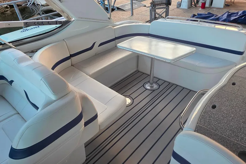 Slide: The Image of 2007 Formula 370 Super Sport boat interior with white seating and table. - 25