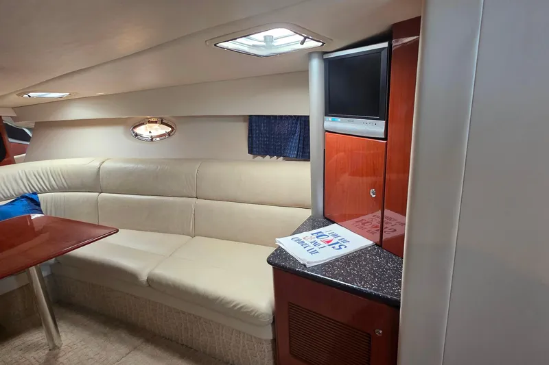 Slide: The Image of Interior of 2007 Formula 370 Super Sport yacht with beige seating and wood accents. - 29