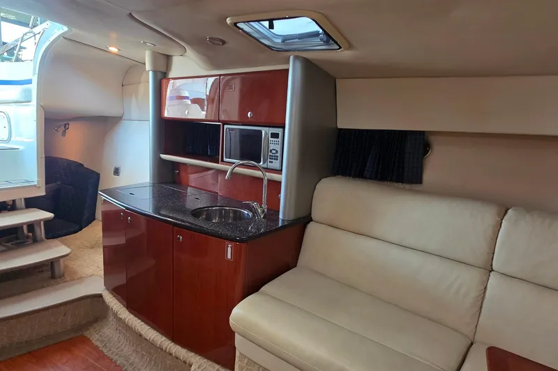 Slide: The Image of 2007 Formula 370 Super Sport yacht interior with kitchenette and seating area. - 31