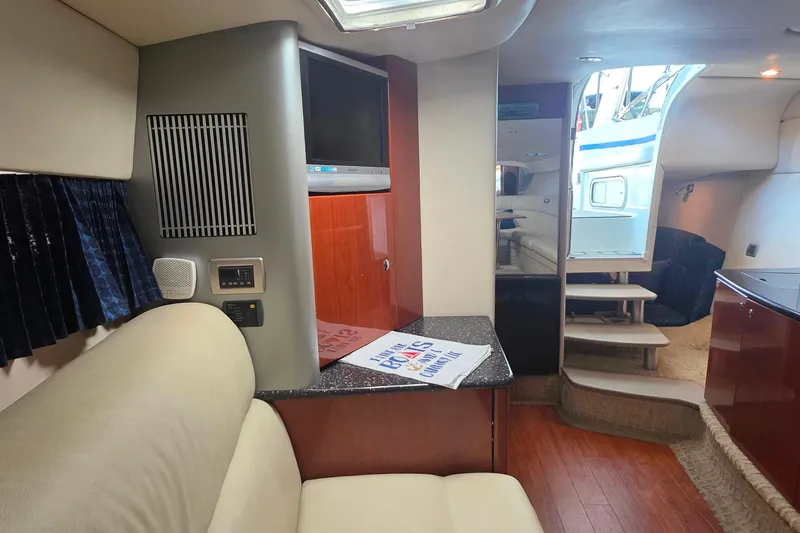 Slide: The Image of 2007 Formula 370 Super Sport yacht interior with TV, seating, and stairs. - 33