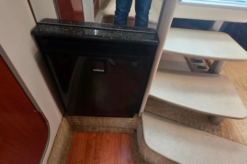 Slide: The Image of Interior of 2007 Formula 370 Super Sport with compact fridge and carpeted stairs. - 34