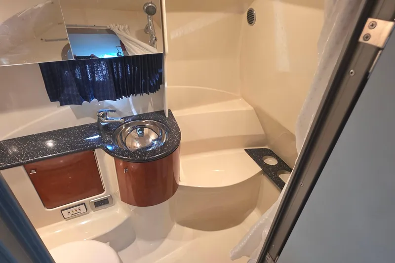 Slide: The Image of 2007 Formula 370 Super Sport bathroom with sink, mirror, and shower area. - 35