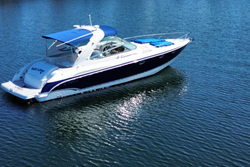 Slide: The Image of 2007 Formula 370 Super Sport boat on calm water, featuring sleek design and blue accents. - 4