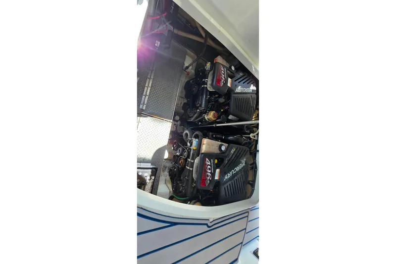 Slide: The Image of Engine compartment of a 2007 Formula 370 Super Sport boat, featuring Mercury engines. - 43