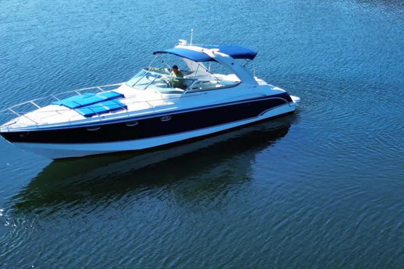 Slide: The Image of 2007 Formula 370 Super Sport boat cruising on calm blue water. - 5