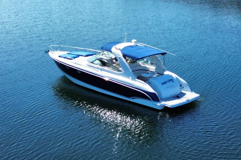 Slide: The Image of 2007 Formula 370 Super Sport boat on calm blue water. - 6