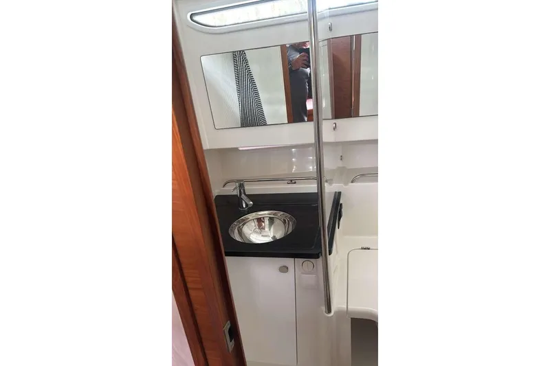 Slide: The Image of Modern bathroom interior of 2021 Nimbus T11 yacht with sleek sink and mirror. - 10