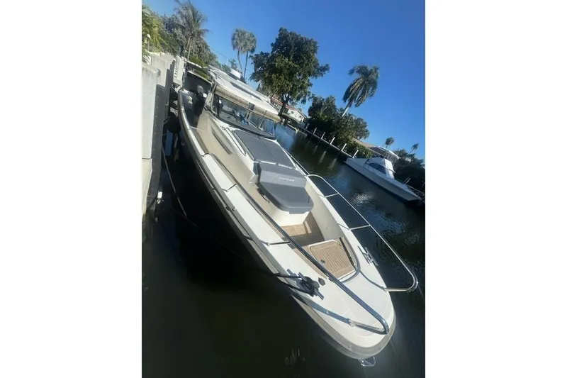 Slide: The Image of 2021 Nimbus T11 boat docked by palm trees on a sunny day. - 4
