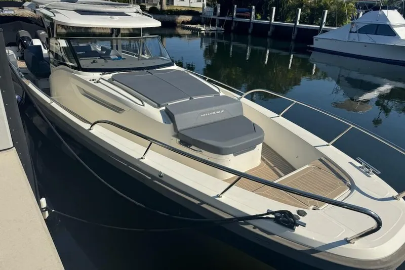 The Image of 2021 Nimbus T11 boat docked in a serene marina setting. - 0