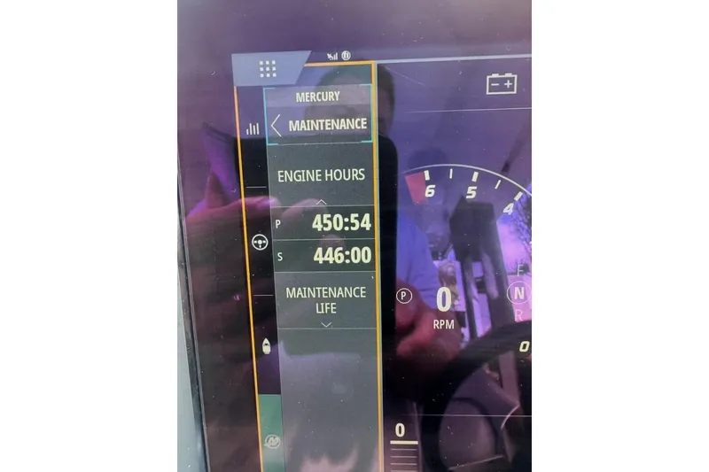 Slide: The Image of Dashboard display of Nimbus T11, 2021 model, showing engine hours and maintenance details. - 6