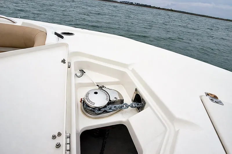 Slide: The Image of 2020 NauticStar 251 Hybrid boat anchor compartment with chain on open water. - 10
