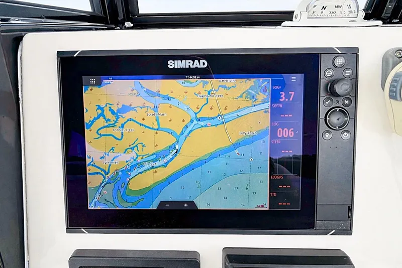 Slide: The Image of Simrad navigation display on 2020 NauticStar 251 Hybrid boat, showing coastal map. - 8