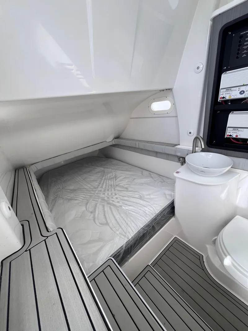 Slide: The Image of 2021 Sea Fox 368 Commander cabin interior with bed, sink, and toilet. - 25