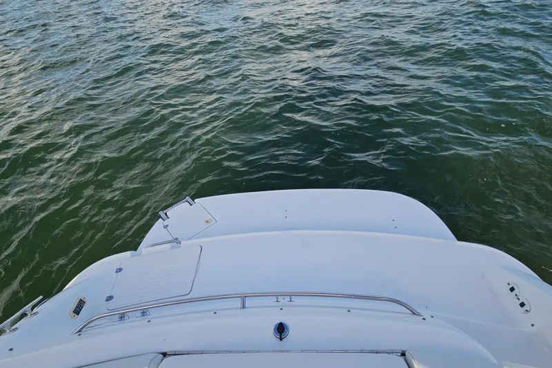 Slide: The Image of 2002 Chaparral 285 SSi boat stern view on calm water. - 11